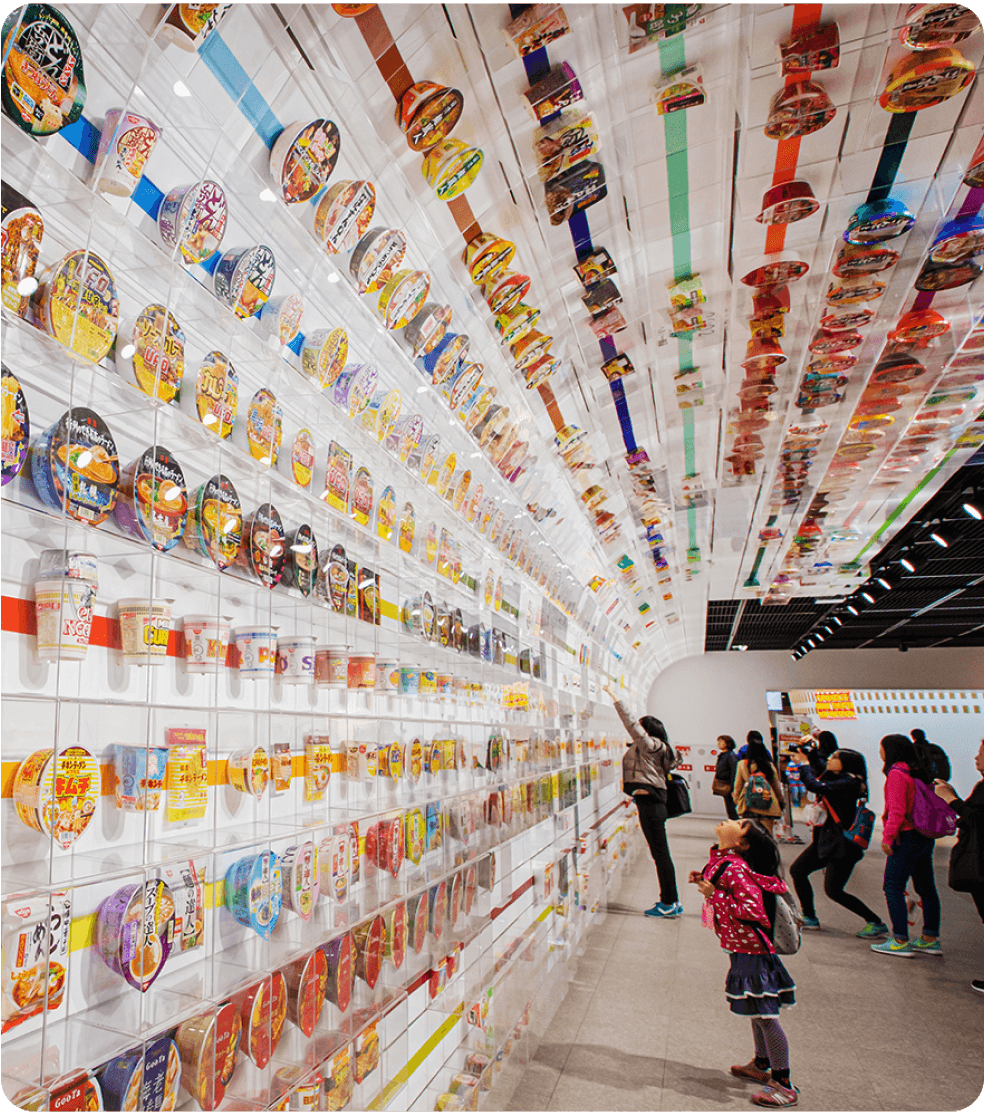 A bunch of people at a ramen museum.